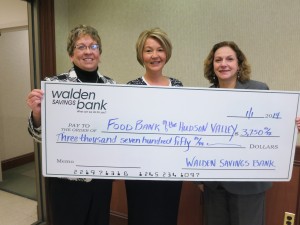 Walden Savings Bank’s Corporate Receptionist, Rachel Millspaugh, and Vice President Marketing Joann Menendez present Antonetta C. Gutter, Director of Development for Food Bank of the Hudson Valley, with a check in the amount of $3,750 from its 2013 Ornament Campaign.