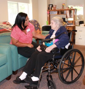 Holly Berry, R.N., Elant at Goshen adult day program director, chats with Ethel Davis, a dementia client, in the adult day program’s Quiet Reflections room.