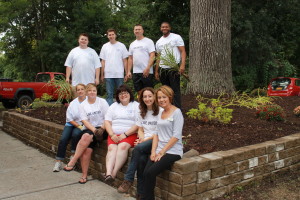 Gathering after completion of their beautification work are, in the rear and from the left: Jordan Mentry, Joe Cuccia, DeWayne Haygood and Kyle Richardson. Front row: Linda Shuback, left, Maria Gardner, Haydee Furman, Michelle Nepton of United Way and Pat Roza of Elant at Fishkill. 