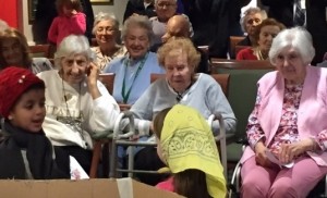 Smiling Promenade at Tuxedo Park residents enjoy watching the George Grant Mason School kindergarten class’ production of “The Mitten.”  Students took the short trip the senior residence to reprise the show they performed several weeks back at the school.